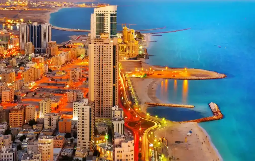 Aerial view of Ajman showcasing the bustling cityscape and coastal beauty, highlighting the strategic location of Ajman Free Zone near key transportation hubs and urban centers.