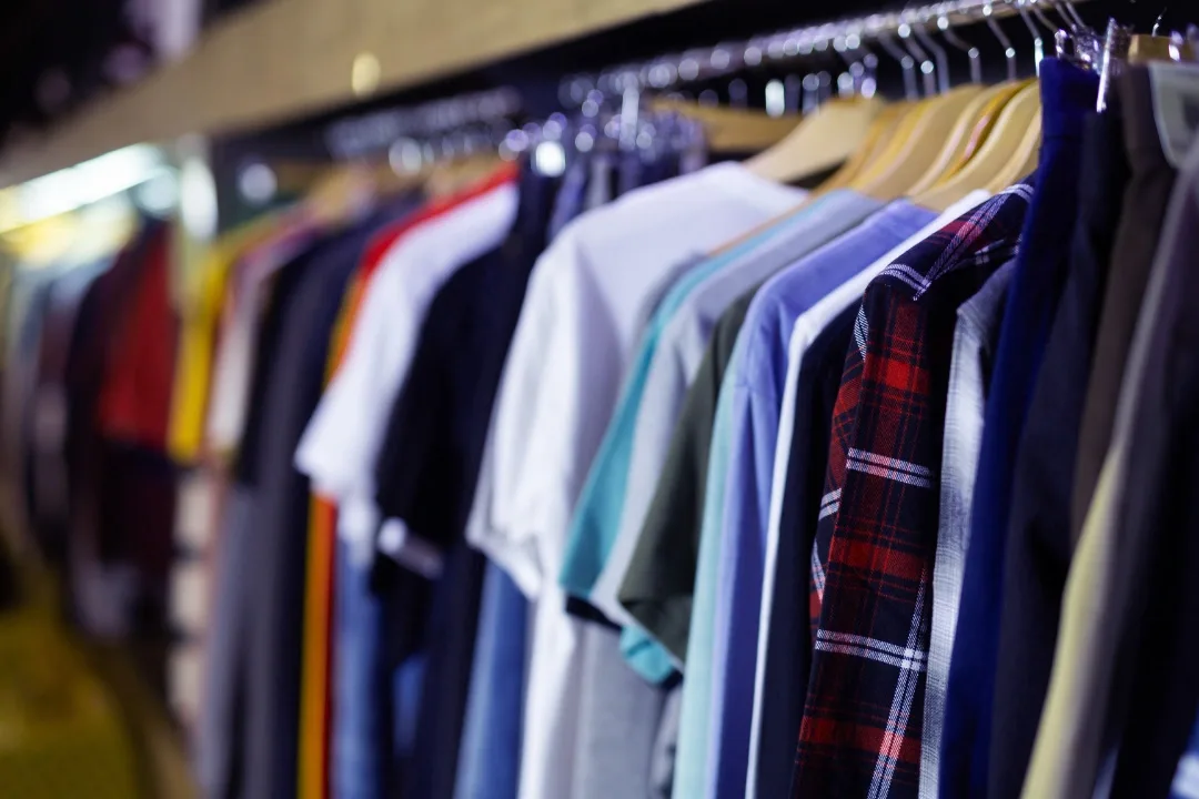 Business setup Dubai for garment trading in DMCC Free Zone showcasing a selection of colorful shirts, ideal for entrepreneurs looking to establish a business in Dubai. Key services include business consultants and business license acquisition in the vibrant market of Dubai.