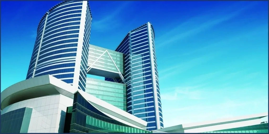 A striking example of modern architecture in the Jebel Ali area, showcasing a building with a unique geometric design near Jebel Ali Port, emphasizing Jafza Offshore Company Formation and company formation in Dubai.